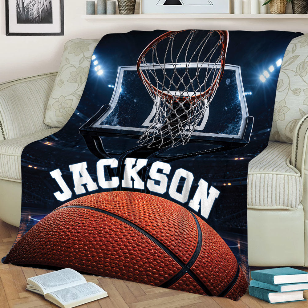 Close view of basketball throw blanket featuring a hoop, backboard, stadium lights, and basketball