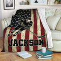 Patriotic hockey throw blanket draped over a sofa with star-spangled player artwork and bold red stripes