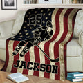 Hockey player throw blanket displayed on a couch with vintage American flag colors and distressed star artwork