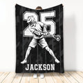 Lacrosse throw blanket with a helmeted player, lacrosse stick, bold athletic artwork, and black camouflage background
