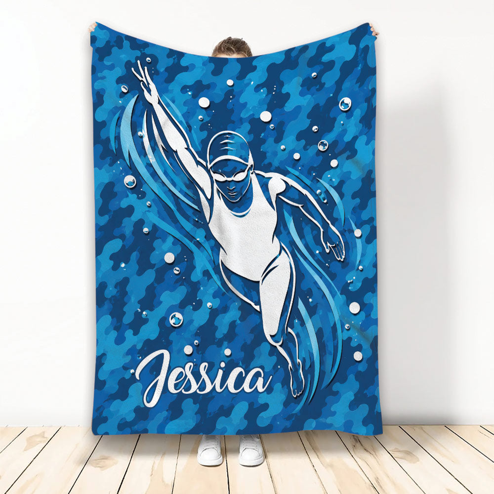 Blue swimming throw blanket featuring an underwater swimmer and dynamic water artwork