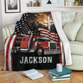 Patriotic semi truck blanket draped over a sofa with eagle, flag, mountain, and cross artwork