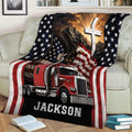 Trucker throw blanket styled on a couch with a red semi truck, eagle, American flag, and scenic design