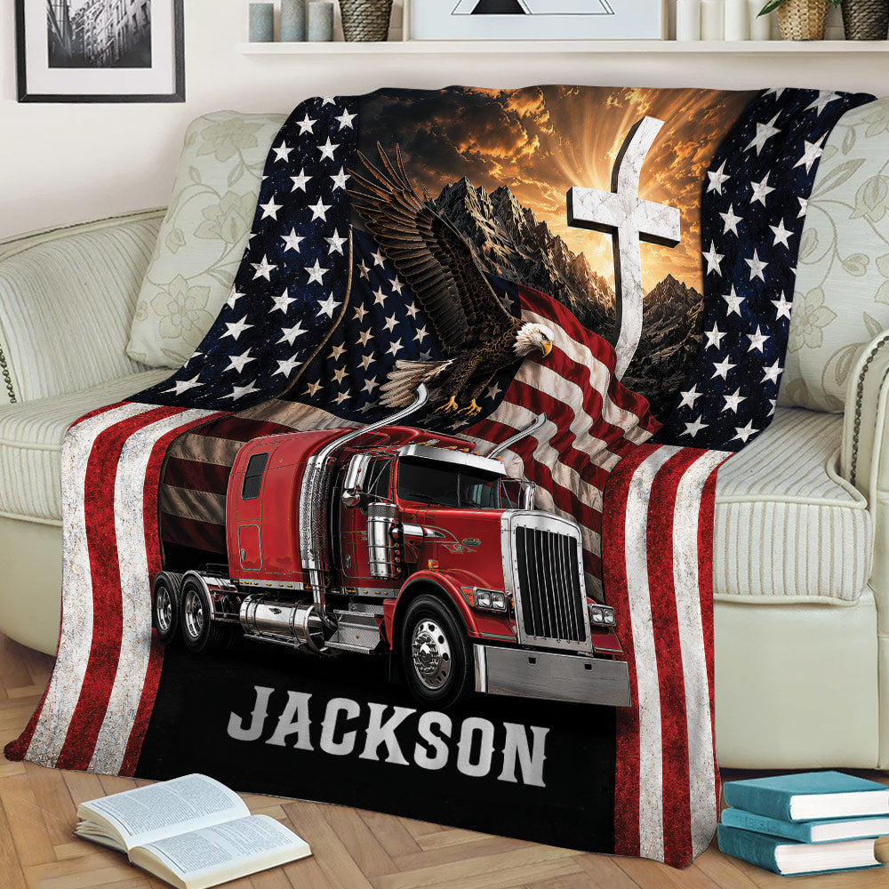 Trucker throw blanket styled on a couch with a red semi truck, eagle, American flag, and scenic design