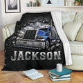 Blue semi truck throw blanket displayed on a sofa in a cozy living room