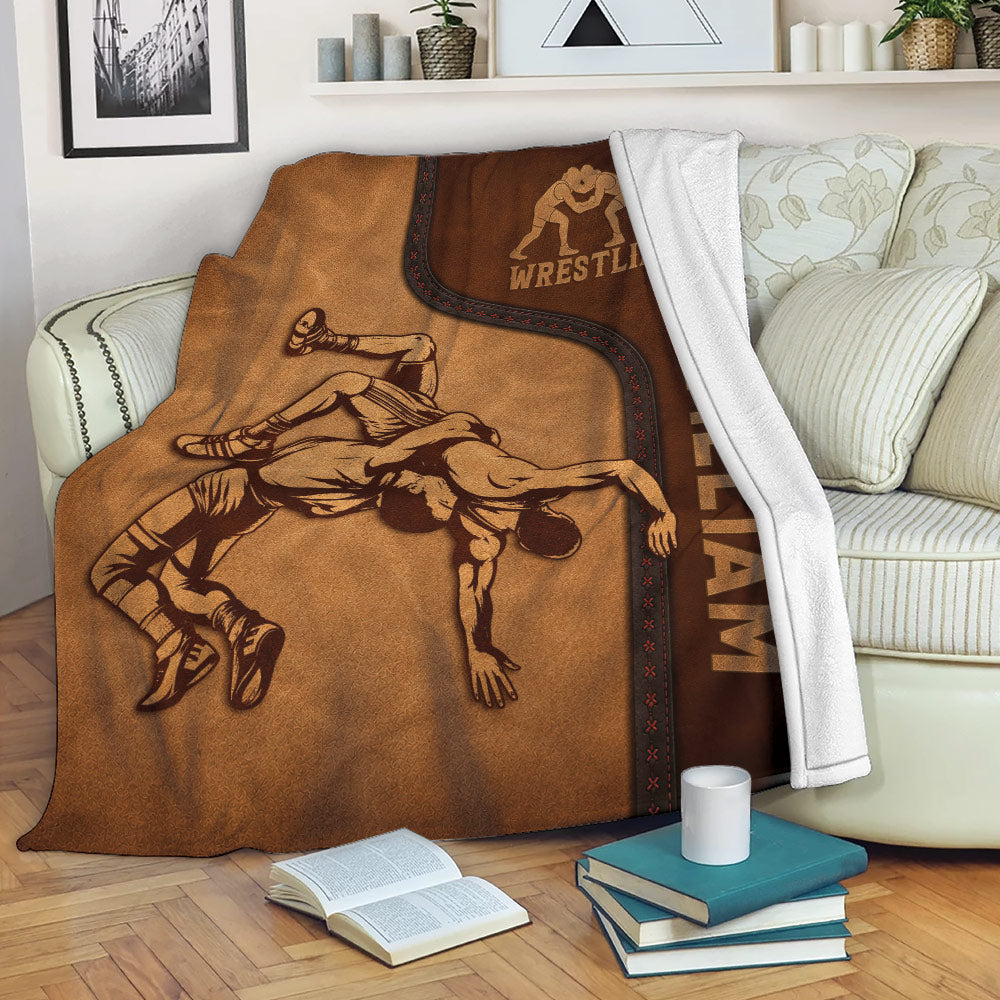 Wrestling throw blanket displayed on a sofa with vintage athlete artwork