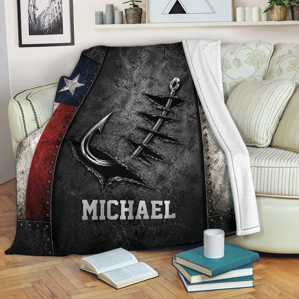 Fishing blanket draped over a sofa, featuring a dramatic hook and lure design with dark metallic artwork
