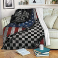 Custom racing throw blanket displayed on a sofa with checkered flag and bold red, white, and blue artwork