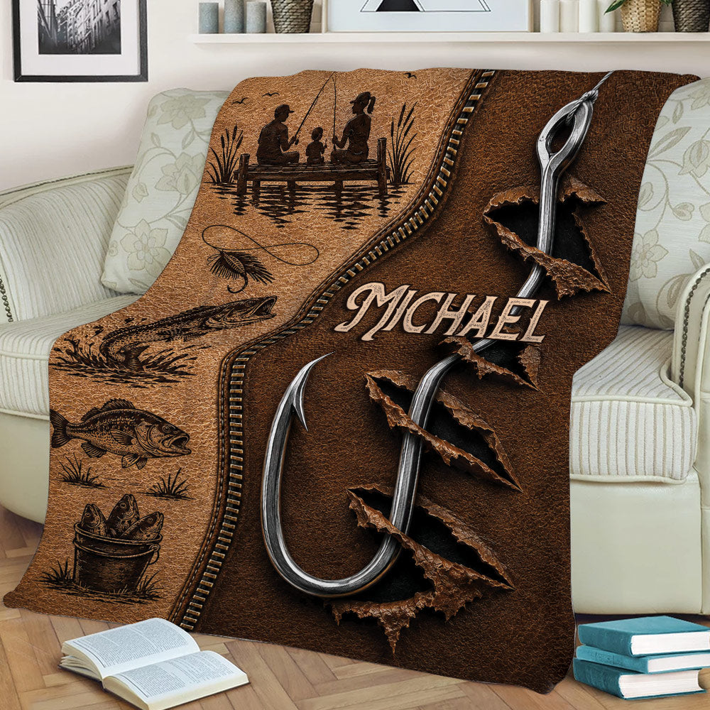 Fishing throw blanket draped over a sofa with fish, rods and lakeside family artwork