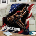 Wrestling throw blanket displayed on a sofa with powerful athlete artwork and red, white, and blue accents