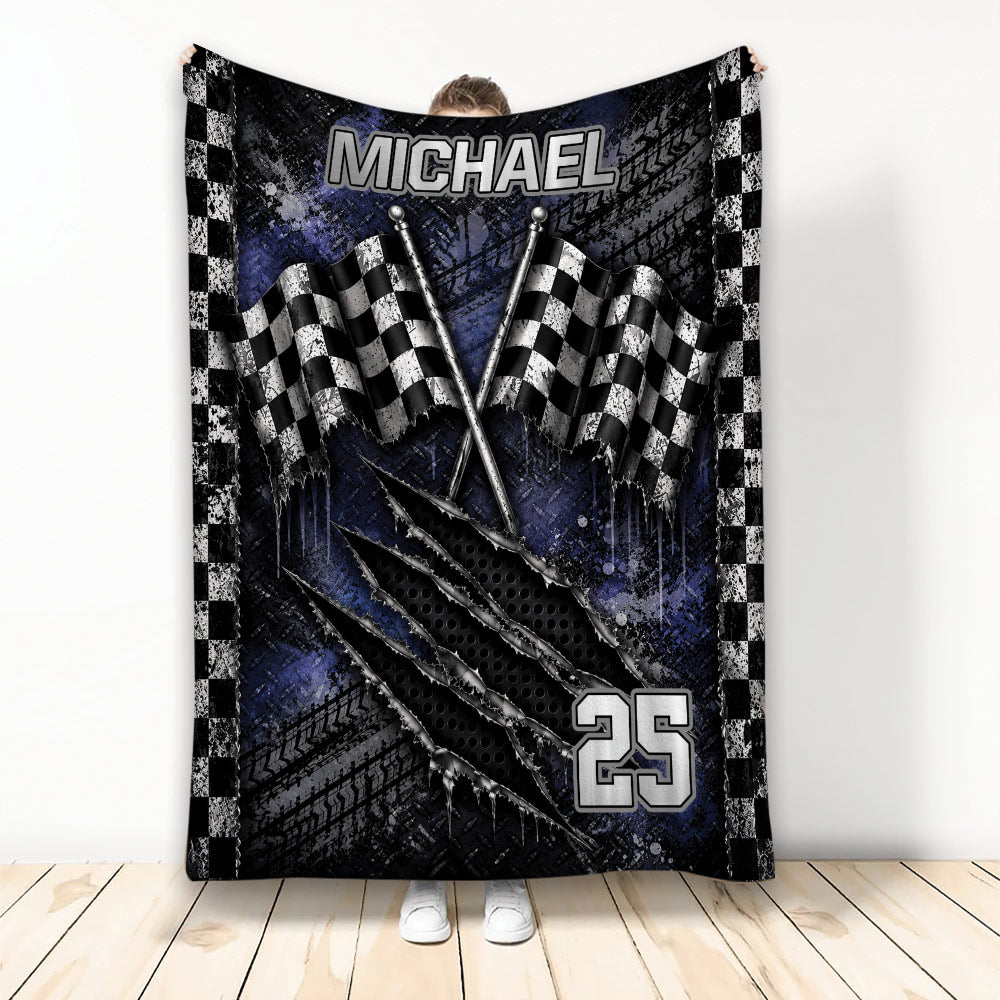 Racing throw blanket with checkered flags, tire tracks, and bold blue and black motorsport artwork