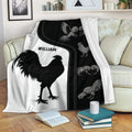Chicken throw blanket draped over a sofa with bold black and white rooster artwork