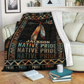 Native American Pride throw blanket displayed on a sofa with feather artwork and geometric tribal-inspired patterns
