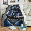 Blue semi truck Trucker Blanket displayed on a couch in a cozy living room setting
