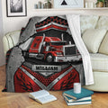 Red semi truck throw blanket displayed on a living room sofa with bold industrial artwork