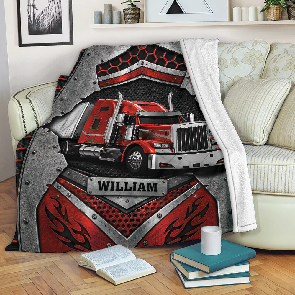 Red semi truck throw blanket displayed on a living room sofa with bold industrial artwork