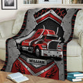 Trucker throw blanket draped across a sofa, featuring a red semi truck and rugged automotive design