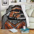 Orange semi-truck Trucker blanket displayed across a sofa in a cozy living room