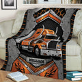 Close view of a Trucker blanket with bold orange big rig and industrial graphic artwork