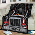 Close lifestyle view of a trucker blanket with detailed semi truck grille, cab, dashboard, and chrome accents