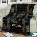 Fishing throw blanket displayed on a couch with a leaping fish, fishing gear, and decorative borders