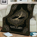 Ornate Tree of Life blanket draped over a couch, featuring Celtic knots and decorative leafy branches