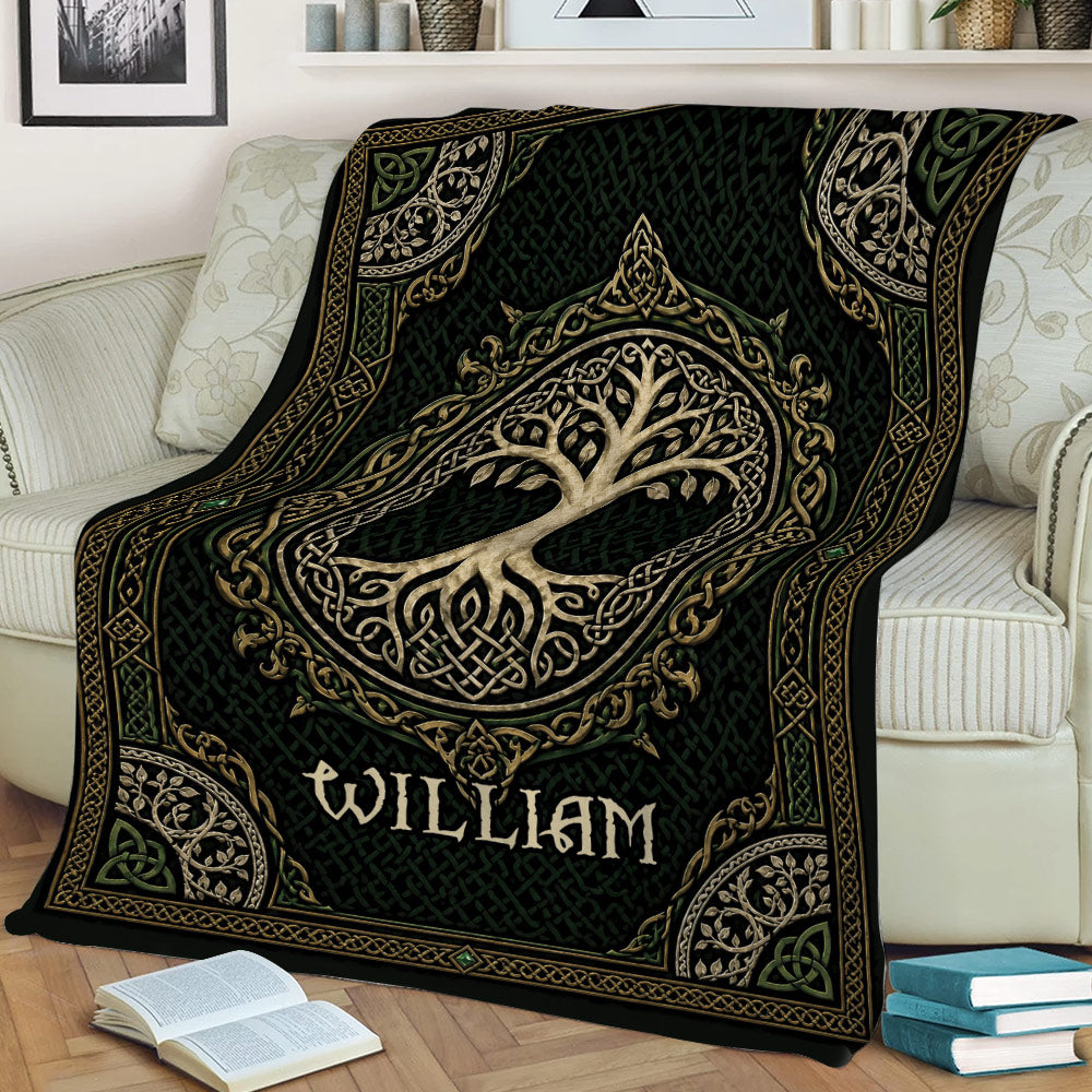 Ornate Tree of Life blanket draped over a couch, featuring Celtic knots and decorative leafy branches