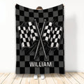 Racing throw blanket with crossed checkered flags and black and gray checkerboard artwork