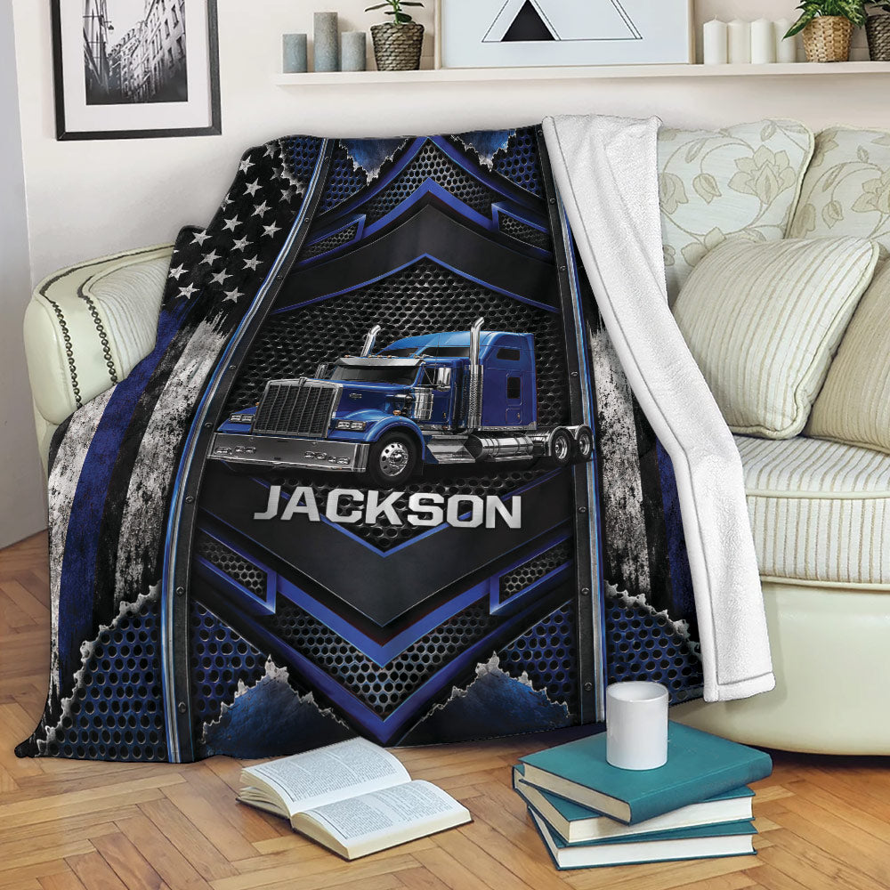 Trucker throw blanket draped over a sofa, featuring a blue semi-truck and patriotic black and blue artwork