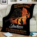 Firefighter mother tribute blanket draped over a sofa with fire service imagery and warm sunset colors
