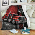 Red big rig Trucker blanket displayed across a sofa with bold black and red artwork