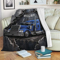 Blue semi truck blanket displayed across a sofa with bold industrial trucking artwork