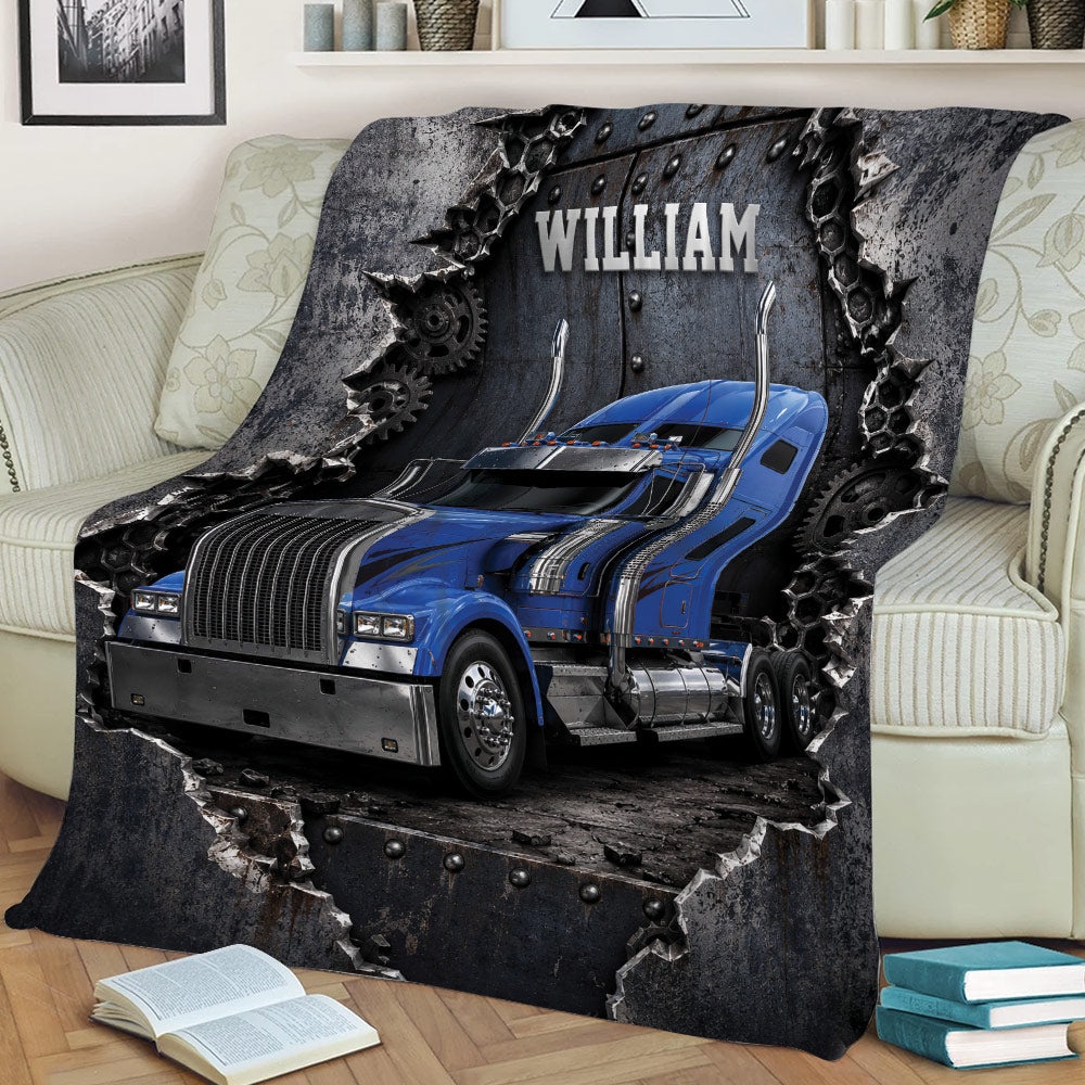 Trucker throw blanket draped over a sofa with blue big rig artwork and rugged gear details