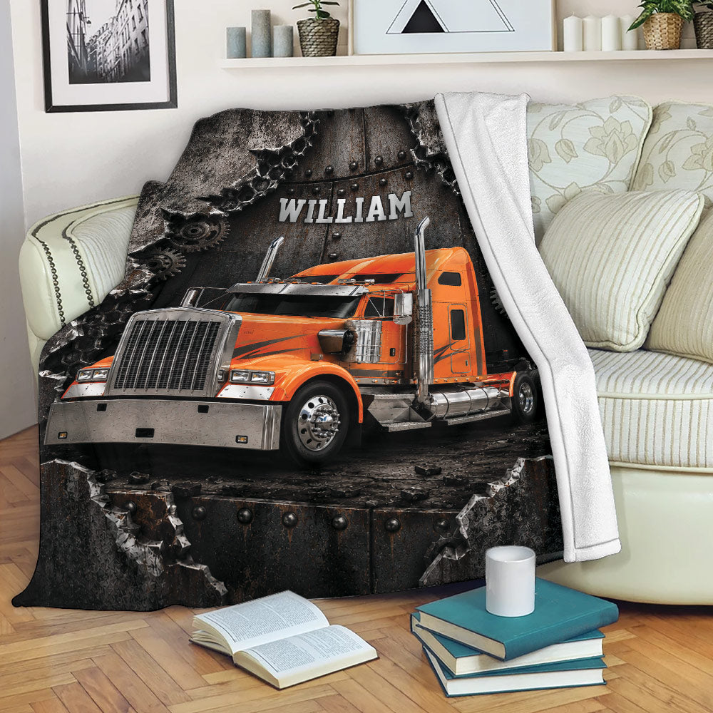 Trucker blanket displayed on a sofa with an orange semi truck and distressed industrial artwork
