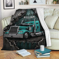 Trucker blanket draped over a sofa with teal semi truck artwork in a cozy living room setting