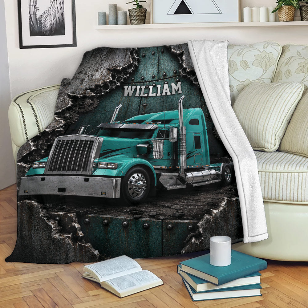 Trucker blanket draped over a sofa with teal semi truck artwork in a cozy living room setting