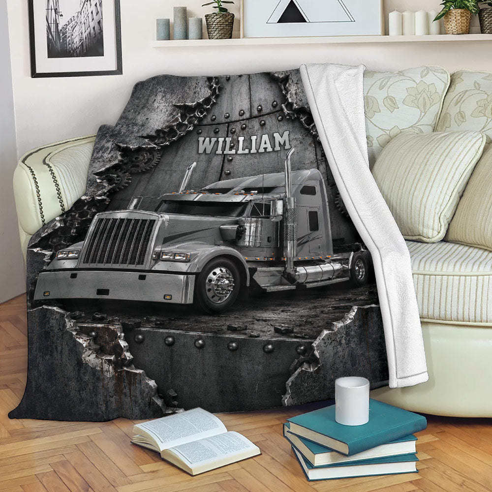 Trucker blanket displayed on a sofa with dramatic silver semi truck and industrial artwork