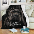 Cane Corso blanket draped over a sofa, featuring bold black dog artwork in a cozy living room