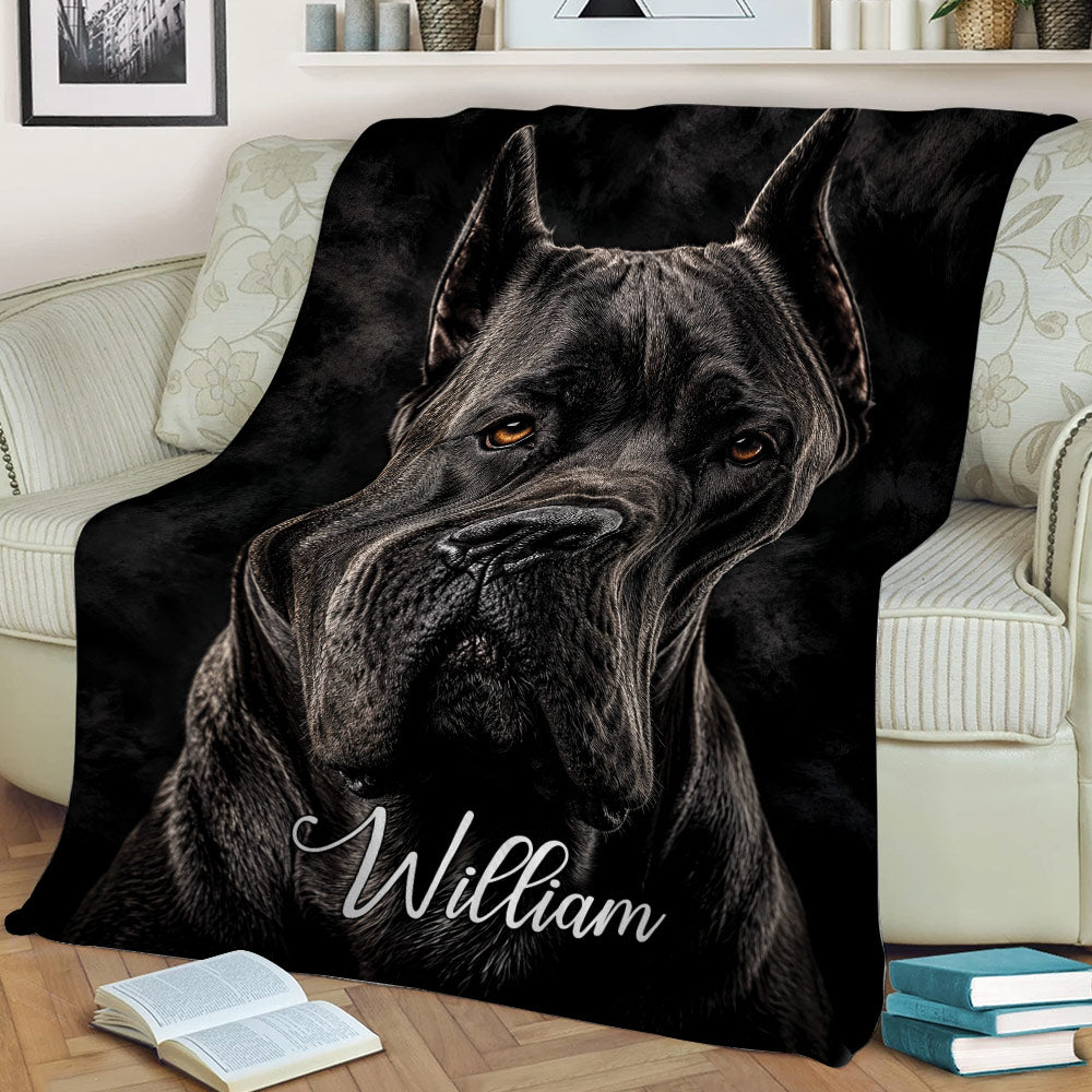 Cane Corso throw blanket styled on a sofa with detailed black dog artwork and dark dramatic tones