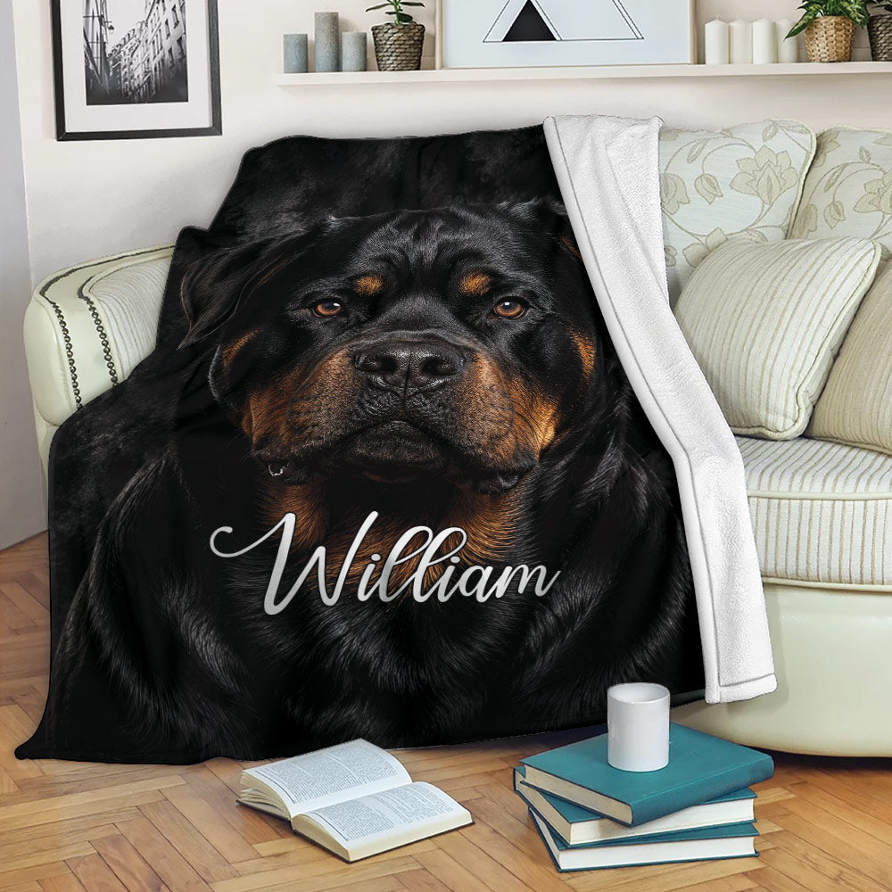 Rottweiler blanket draped over a sofa, showcasing bold black and tan dog artwork
