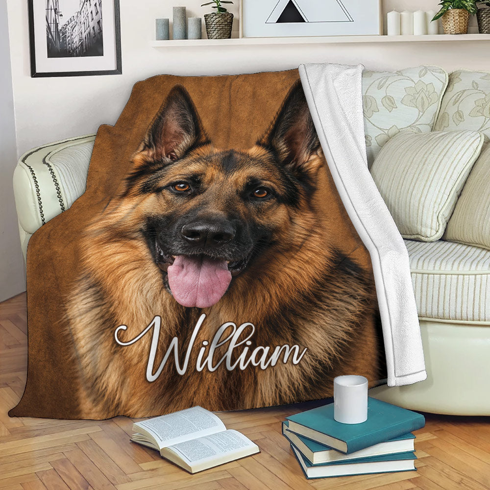 German Shepherd blanket draped over a sofa with realistic dog artwork in a cozy living room