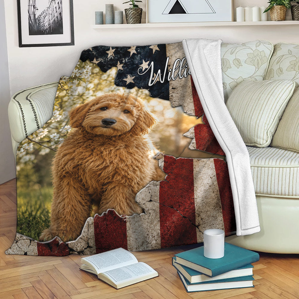 Goldendoodle throw blanket displayed on a sofa with patriotic stars and distressed red, white, and blue stripes