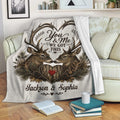 Deer hunting throw blanket styled on a cozy sofa with romantic woodland artwork