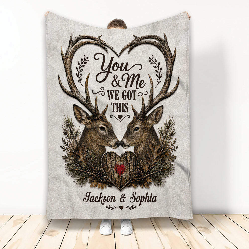 Rustic hunting blanket featuring two deer beneath heart-shaped antlers and woodland foliage