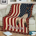 American Native throw blanket draped over a couch with patriotic colors, feather artwork, and geometric trim