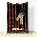 American Native-inspired blanket with feather artwork, geometric patterns, and a bold black, red, and gold design