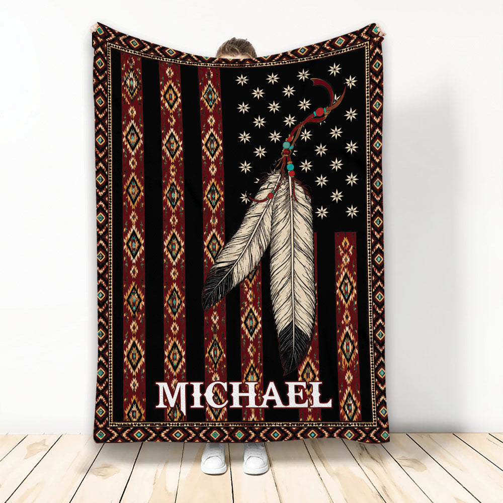 American Native-inspired blanket with feather artwork, geometric patterns, and a bold black, red, and gold design