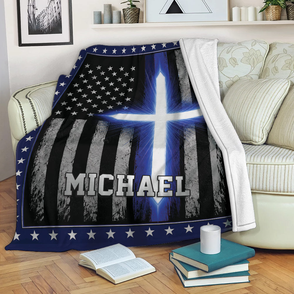 Police-themed throw blanket displayed on a sofa with thin blue line flag artwork and star border