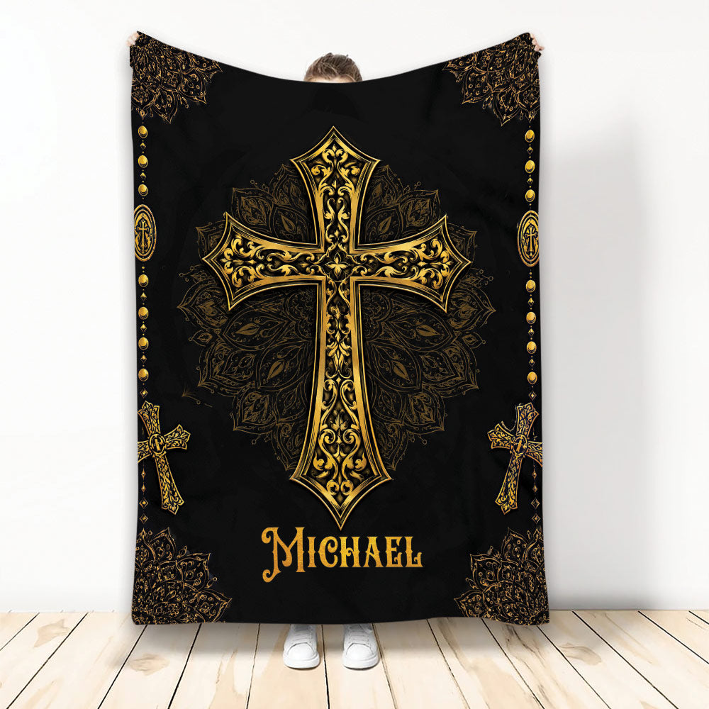 Christian throw blanket with an ornate gold cross and decorative black and gold border