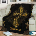 Black and gold Christian throw blanket displayed on a sofa with an ornate cross design